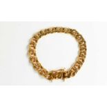 A Continental gold double fancy link bracelet, of flattened circular effect links, marks