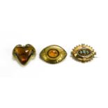 A group of three Victorian and later brooches, including an oval brooch set with turquoise