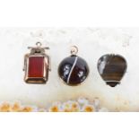 A Victorian banded agate pendant, in rolled gold setting, a swivel fob locket pendant set with jet