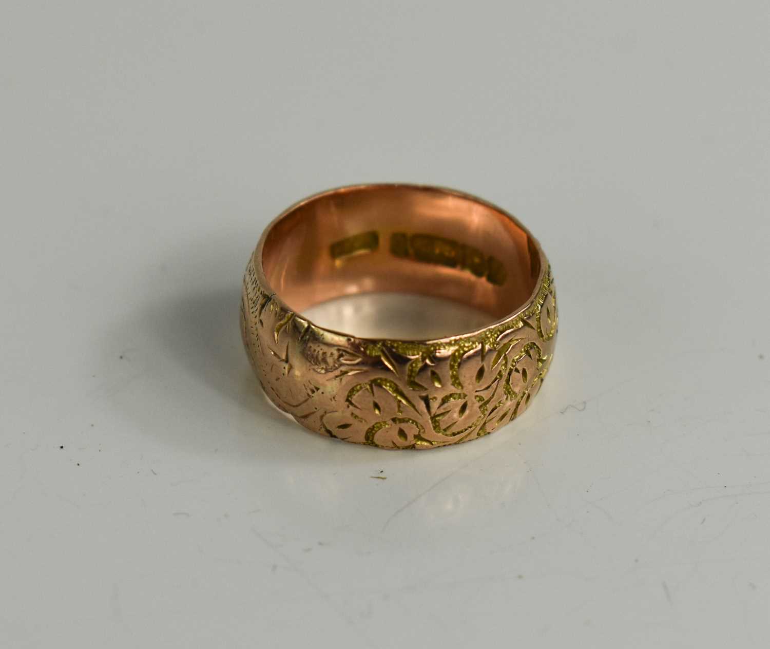 A 9ct gold wedding band, foliate engraved, size L, 4.51g.