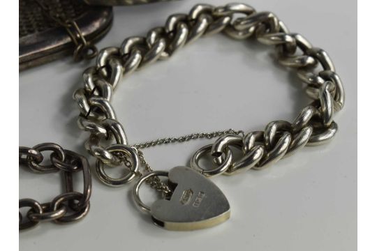 A silver curb link charm bracelet, with heart shaped padlock clasp, and a silver large figaro link - Image 3 of 5