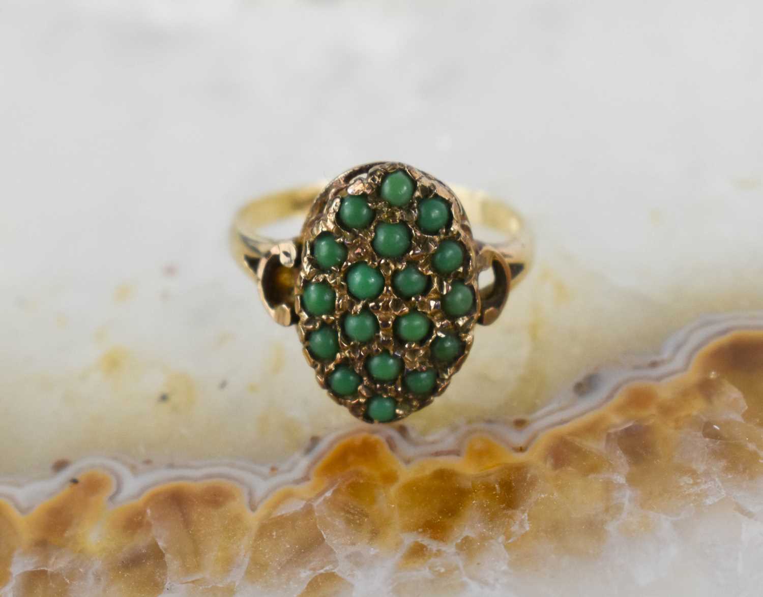 A vintage 9ct gold ring, the large marquise shaped setting with eighteen jade cabouchons, size O, - Bild 2 aus 3