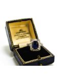 An Art Deco 18ct gold, platinum, sapphire and diamond ring, the central oval cut stone of