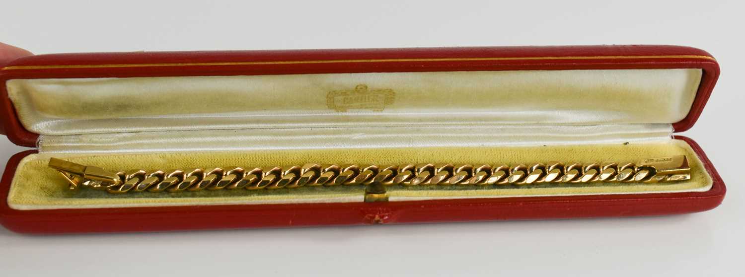 A Cartier 9ct gold curb link bracelet, 18cm long, fully marked to the clasp, makers mark B & S,