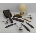 A group of collectables to include a brass desk calendar, cutt throat razors, ostrich egg,