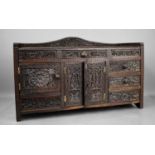 A fine 19th century Anglo-Indian rosewood cabinet, carved with flowers, fruit and birds with central