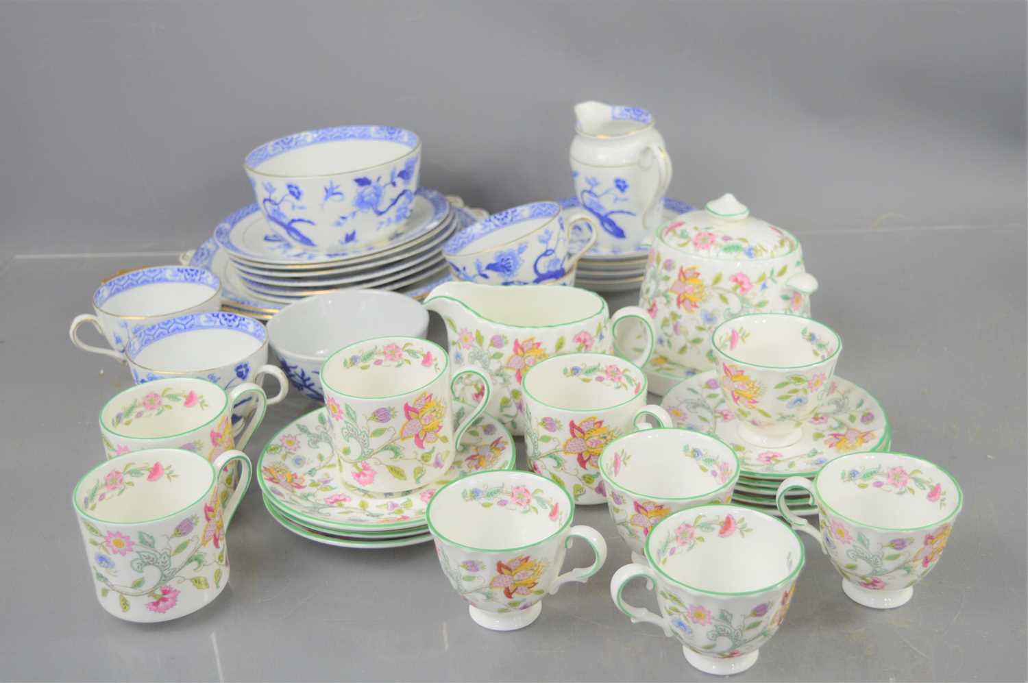 A Minton "Haddon Hall" tea set comprising teapot, cups, saucers and milk jug together with a