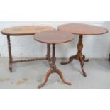 Three occasional tables, one Victorian mahognay oval top tripod table, an oak example with pad