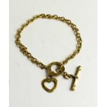 A 9ct gold Cartier style bracelet, with chain links, bar & hoop and a heart charm, 9g.