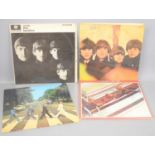 Four Beatles vinyl record albums comprising of Abbey Road, PCS 7088, Beatles 1962-1966, Beatles