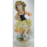 A large Capodimonte porcelain figure of young girl feeding a goose, 69cm high.