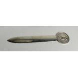 A French Christofle silver plated page turner / letter opener, the top having a Napoleon Empereur