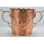 An Art Nouveau copper and brass wine cooler with embossed floral decoration by Carl Deffner, 18.