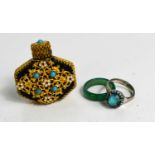 A jade ring, a silvered and turquoise set ring and a gilt metal and enamelled scent bottle.