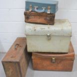 A vintage metal steamer trunk together with metal bound suitcase and two further examples.