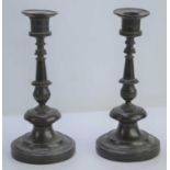 A pair of 19th century Empire style bronzed candlesticks, 20cm high.