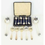 A cased set of six silver teaspoons together with two silver table spoons and six further teaspoons,