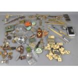 A group of collectable items to include vesta cases, petrol lighters, letter openers, ARP buttons,