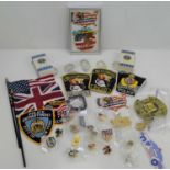 Two George Bush presidential m&m packets with contents, various police patches and pin badges to