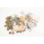 A quantity of GB and worldwide coinage and banknotes to include some silver examples.