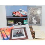 Two vintage motorsport calendars, Meat Loaf concert programme, signed photo of the cast of