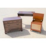 A mahogany card table together with a small cabinet and wash basket.