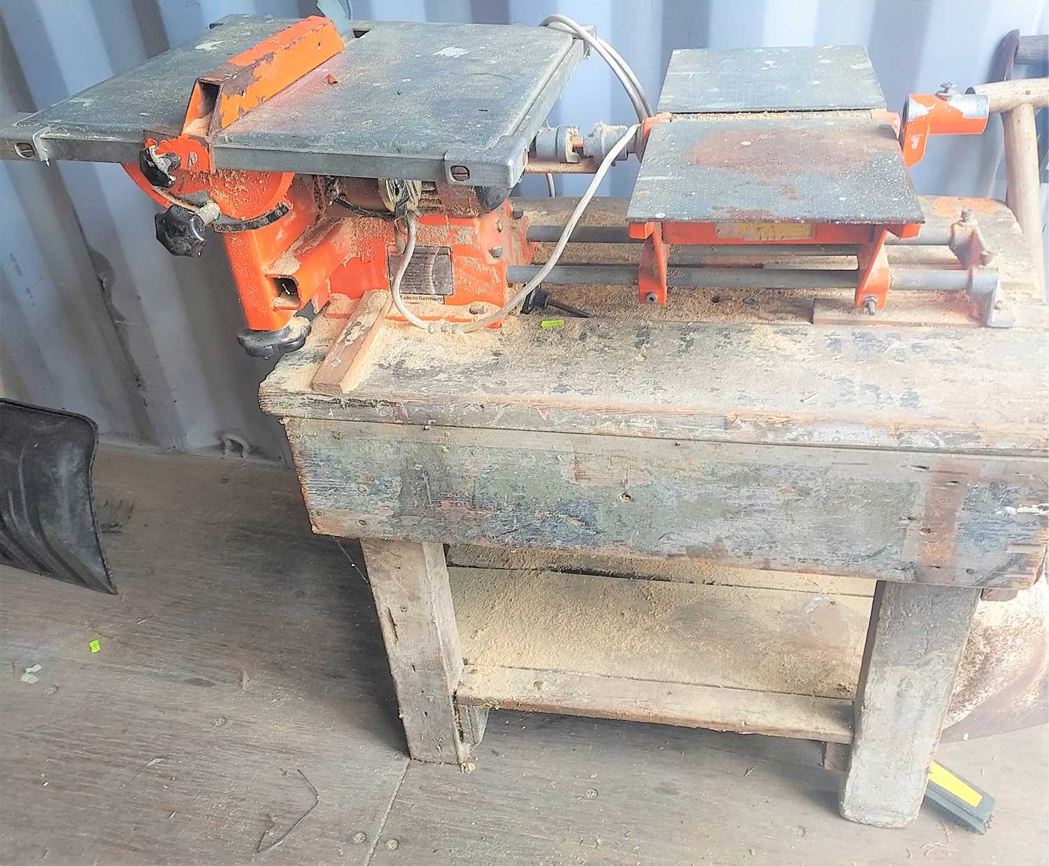 An Alko table saw and planer with wooden bench together with a bandsaw