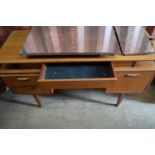 A mid-century G-Plan teak dressing table.