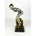 An Art Deco style figure of a lady, resin and metal.