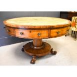A Regency mahogany drum table, inset green leather top, four real and four false drawers, on