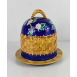 A small pottery cheese dish, with cobalt blue ground, and basket weave decoration.