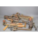 A group of vintage tools to include a Record plane, chisels, hammers, squares and others.