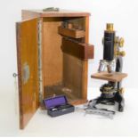 A vintage W.Watson and Sons "Service" microscope in original wooden case together with a vintage