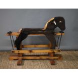 A vintage handmade rocking horse covered in faux fur.