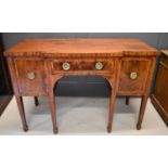 A Regency period mahogany breakfront sideboard, with a single drawer flanked by a cupboard and