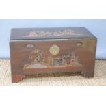 A Chinese carved wooden chest, carved with figural scenes to the top and front, raised on bracket