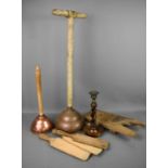 An antique clothes dolly, a copper dolly, a group of butter moulds, a treen barley twist candlestick