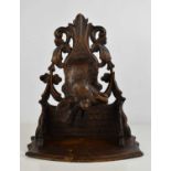 A Blackforest style wall bracket, carved in the form of a stag head, with pierced and carved foliate