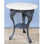 A cast iron painted table with onyx top, 71cm high.