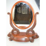 A Victorian mahogany oval back toilet mirror.