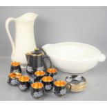 A Prinknash Pottery Gloucester coffee set, in black and gold with white flowers together with a