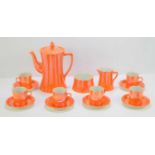 A Carlton Ware orange lustre coffee set.