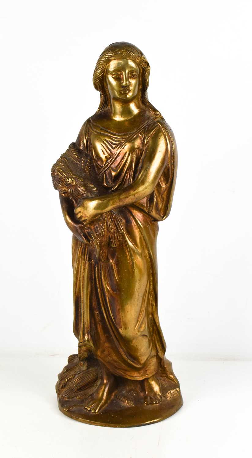 A gilt bronze early 20th century woman holding sheaf of wheat, 44cm.