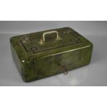 An Art Deco period cash tin with key, decorated in a green faux marble enamel with black and gold