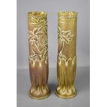 A pair of WWI dated brass trench art vases depicting a bird among flowers.