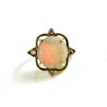 A 14ct gold, diamond and opal ring, the large circular opal in a quatrefoil setting and four