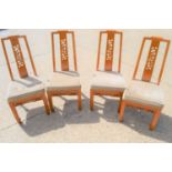 A set of four hardwood Chinese chairs with carved back splat.