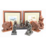 A resin figure group of the three wise monkeys together with carved wooden elephant bookends, a