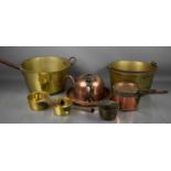 Two large antique jam pans, a copper half kettle, together with smaller copper and brass pans.