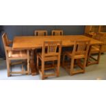 A Robert 'Mouseman' Thompson oak dining table and six chairs, the rectangular table on octagonal